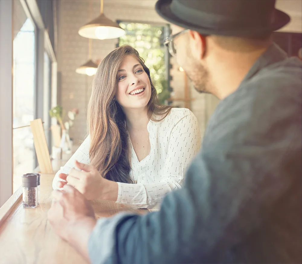 woman and man conversation at coffee shop