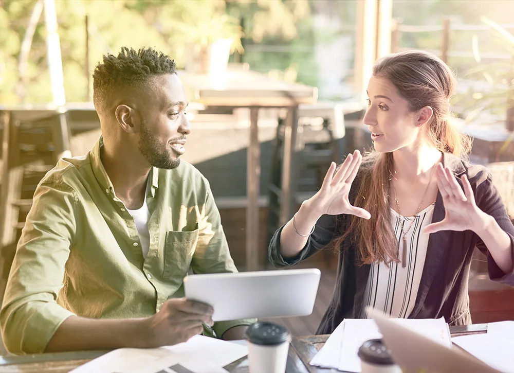 woman and man conversation at coffee shop