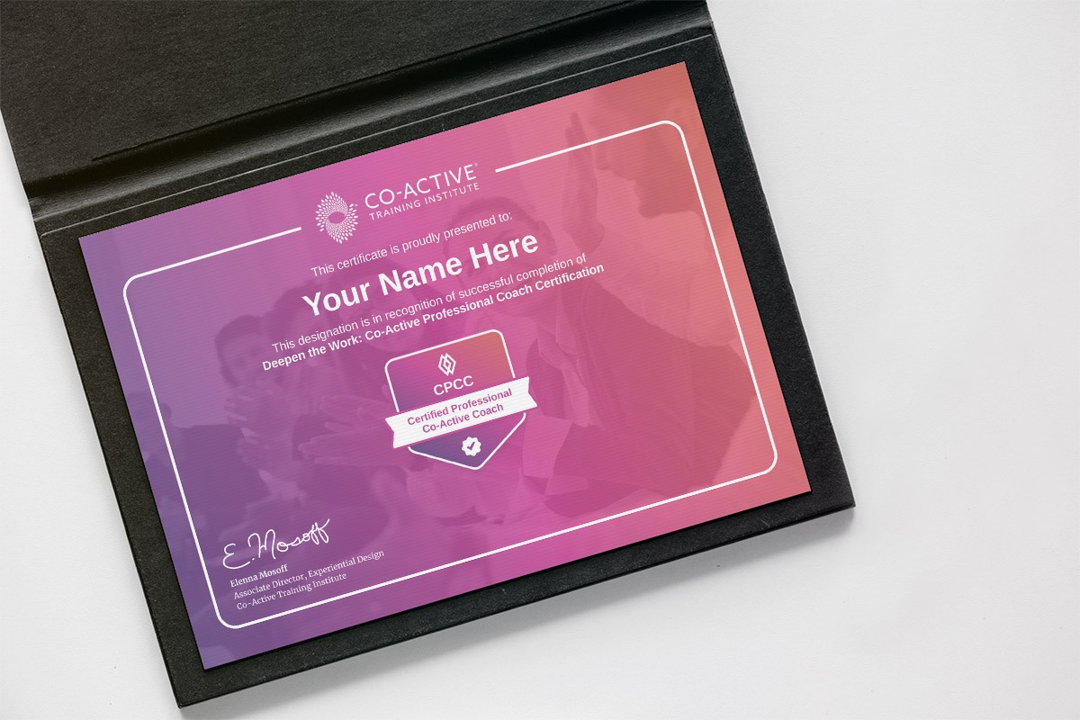 Framed coaching certification certificate on wall